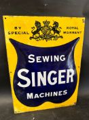 A rare and early Singer Sewing Machines enamel advertising sign with Royal Warrant by Mather &