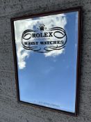 An advertising mirror from well known Mayfair wrist watch store, 20 1/2 x 28 3/4