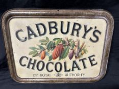 A Cadbury's Chocolate by Royal Authority pictorial tin advertising sign with advertising also to ver