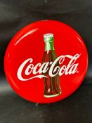 A circa 1990 Coca-Cola enamel button advertising sign, 18 1/4
