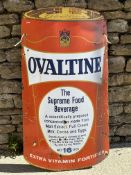 A rare Ovaltine enamel advertising sign in the shape of an Ovaltine product tin