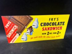 A late 1930s tram advertising card for Fry's Double Milk Chocolate Sandwich depicting three