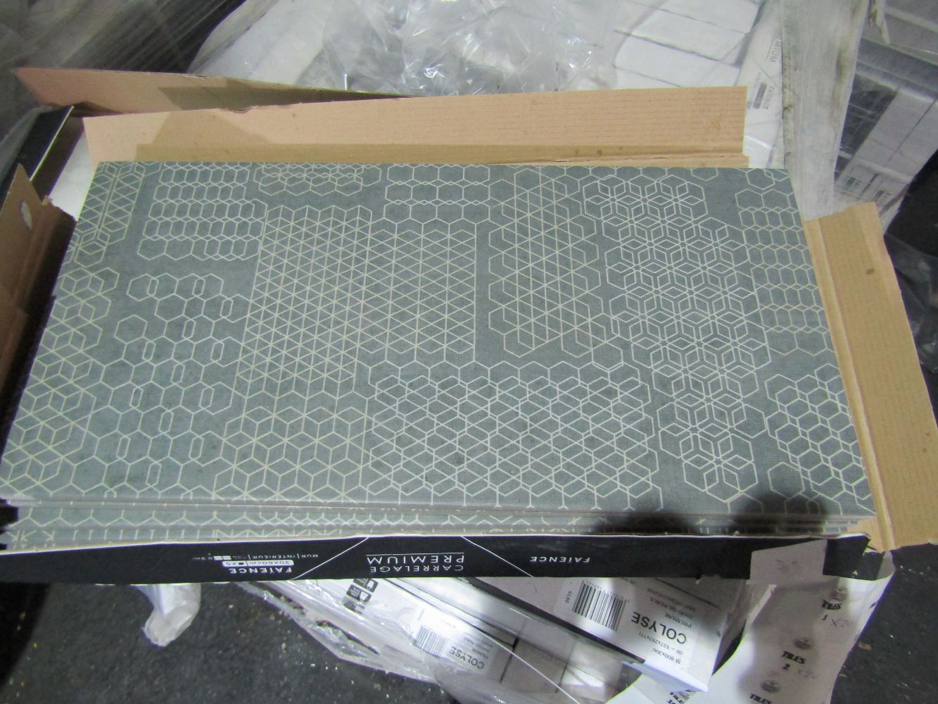 Pallets and Packs of Johnsons tiles.