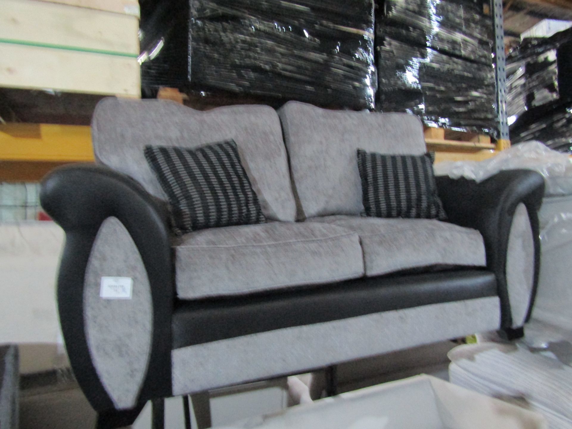 2 seater grey and black sofa, unchekced but looks in good condition at a glance