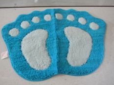 Blue & White Paw Print Rug - Packaged.