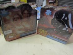 2 x Star Wars collectors puzzles. 1000 pcs in each. Product is in a sealed bag but tins are slightly