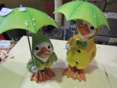 2x Ceramic Rainy Days Ducks, Green & Yellow - One Of The Ducks Hand Is Broken.
