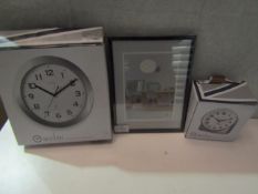 3Items being an alarm clock,a small wall clock & a 5" x 7" black frame. Untested/unchecked2