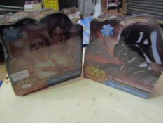 2 x Star Wars collectors puzzles. 1000 pcs in each. Product is in a sealed bag but tins are slightly