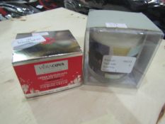2x Items Containing 1xVera Cover Paris Ferming Cream, 1xScented Candle, Unchecked & Packaged.