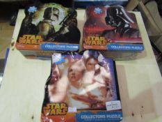 3 x Star Wars collectors puzzles. 1000 pcs in each. Product is in a sealed bag but tins are slightly