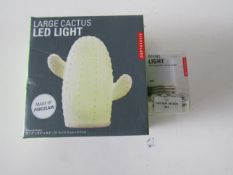 Kikkerland - Large Cactus LED Light - Boxed. Kikkerland - Portable Spring Light - Packaged.