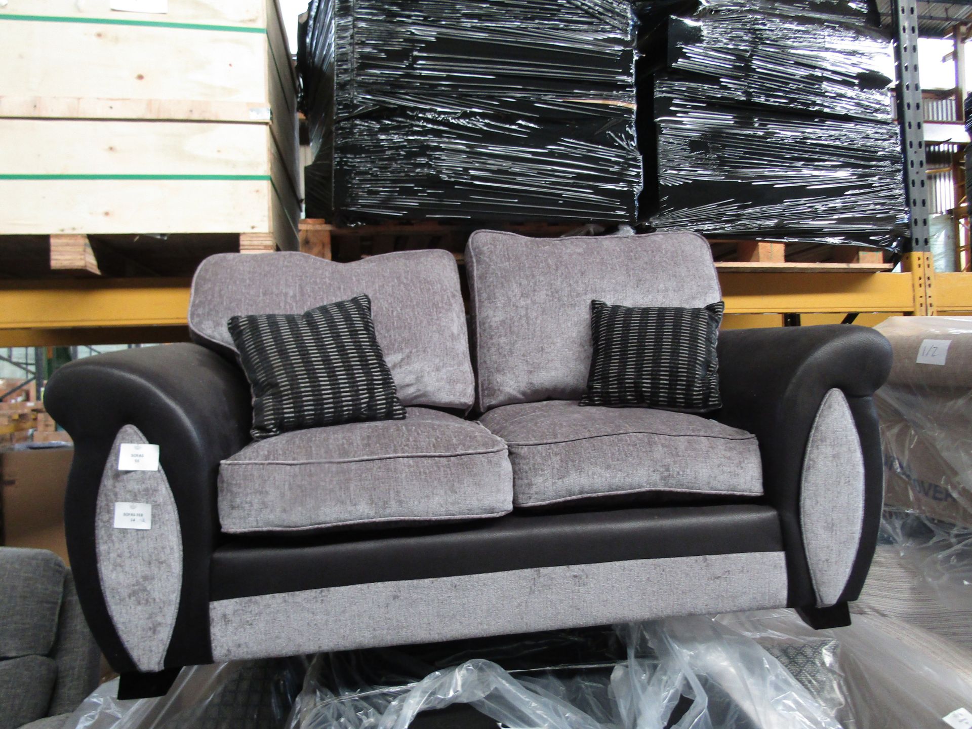 2 Seater grey and Black sofa, looks in good condition upon quick inspection