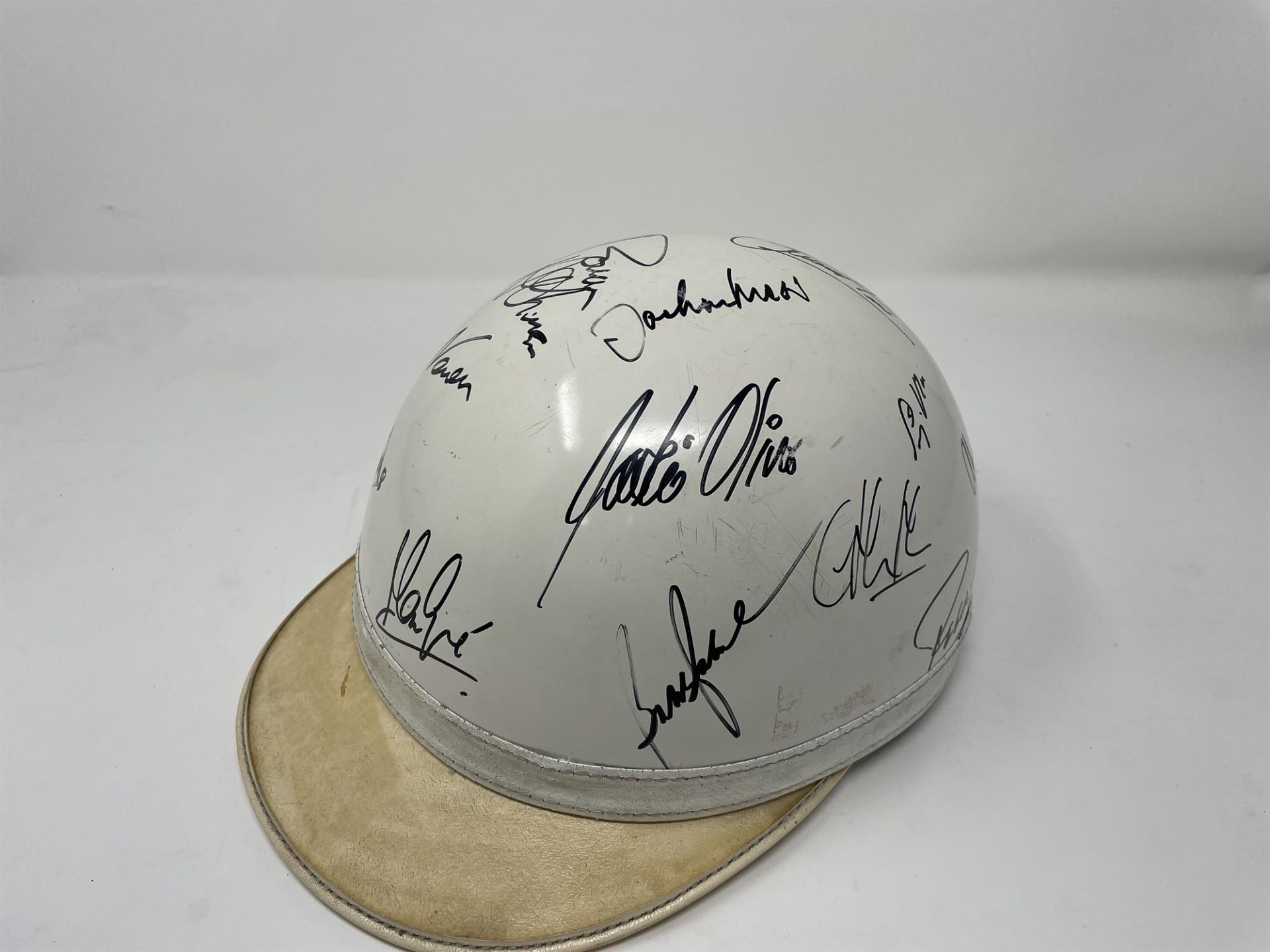 1950s-Style Race Helmet with Multiple Signatures Including Sir Jackie Stewart and Sir Stirling Moss