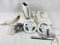 Nintendo Wii with two controllers, two nunchucks, balance board, gun controller and nine games