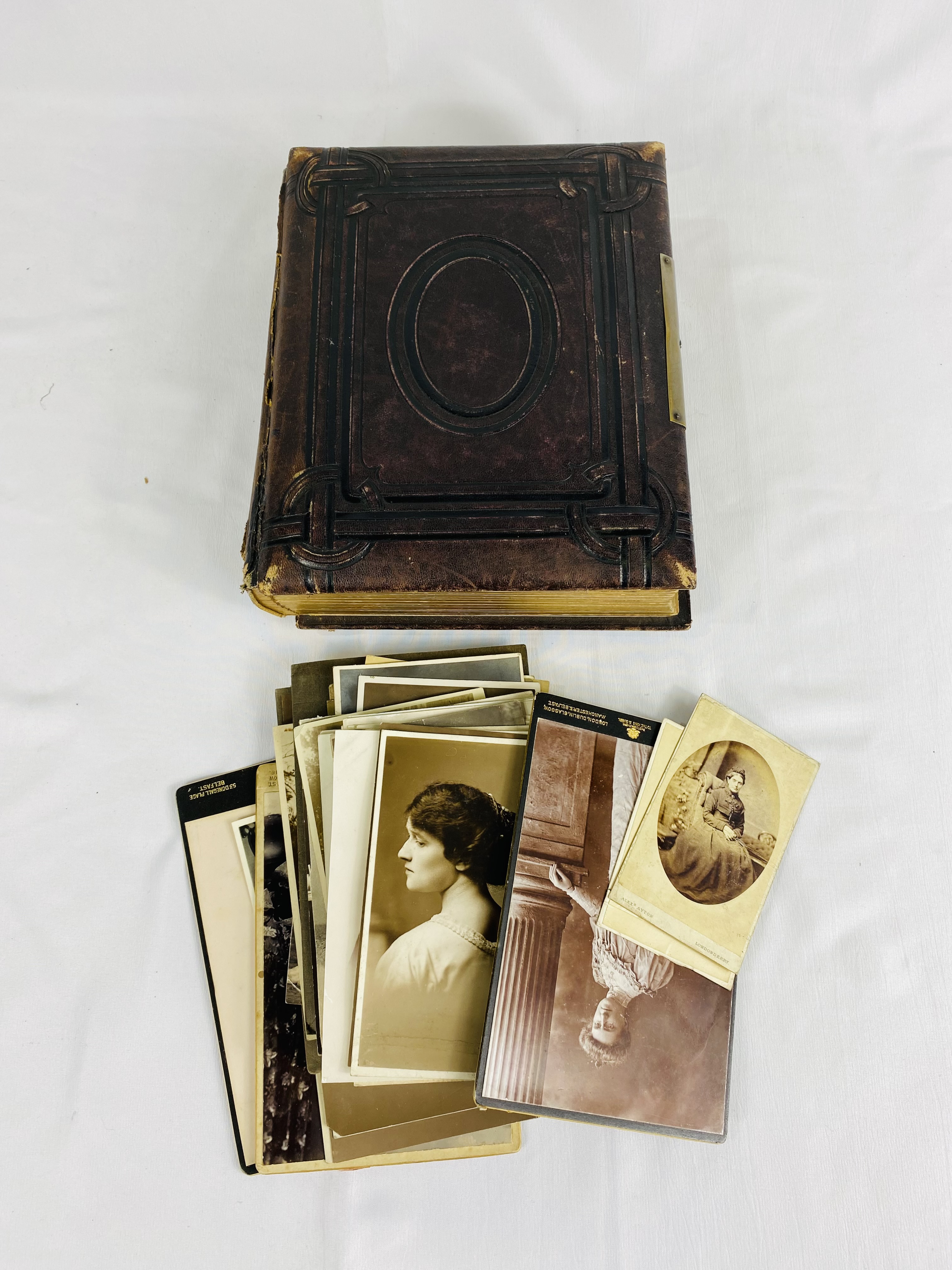 Victorian embossed photograph album and photographs