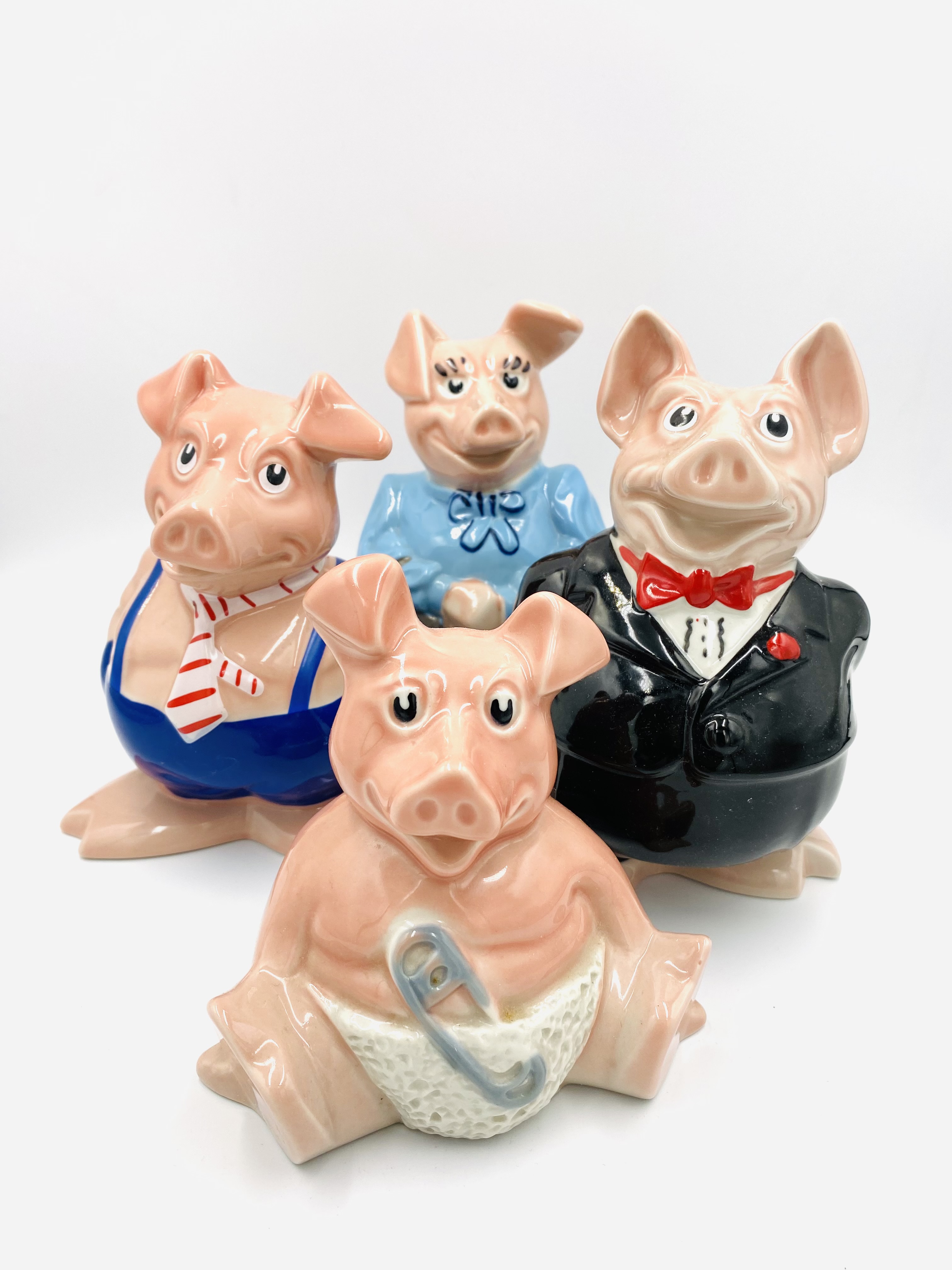 Four Natwest pig money boxes