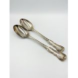 Two silver serving spoons