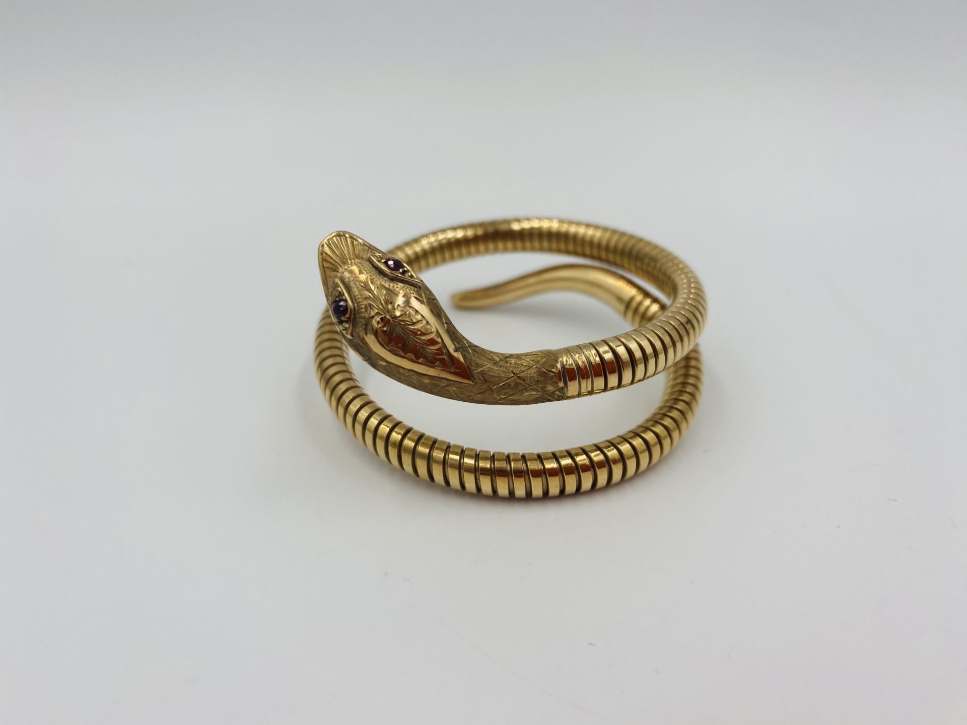 9ct gold, steel sprung snake bracelet