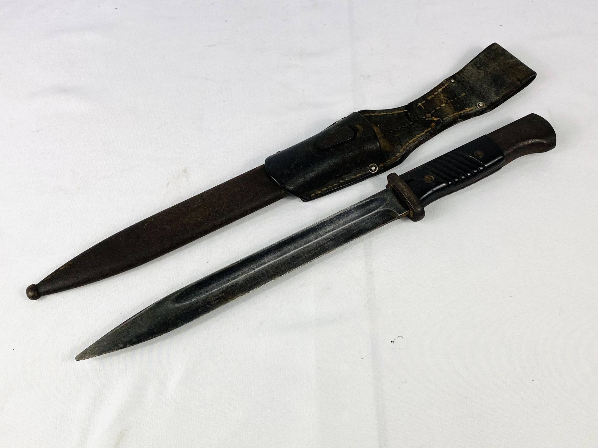 World War II bayonet written to blade Coppell G.m.b.H N20995K in leather scabbard. - Image 2 of 4
