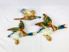 Two ceramic flying ducks and a ceramic flying pheasant