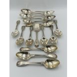 Four large and twelve smaller silver spoons