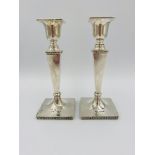 Pair of weighted silver candlesticks by Walker & Hall