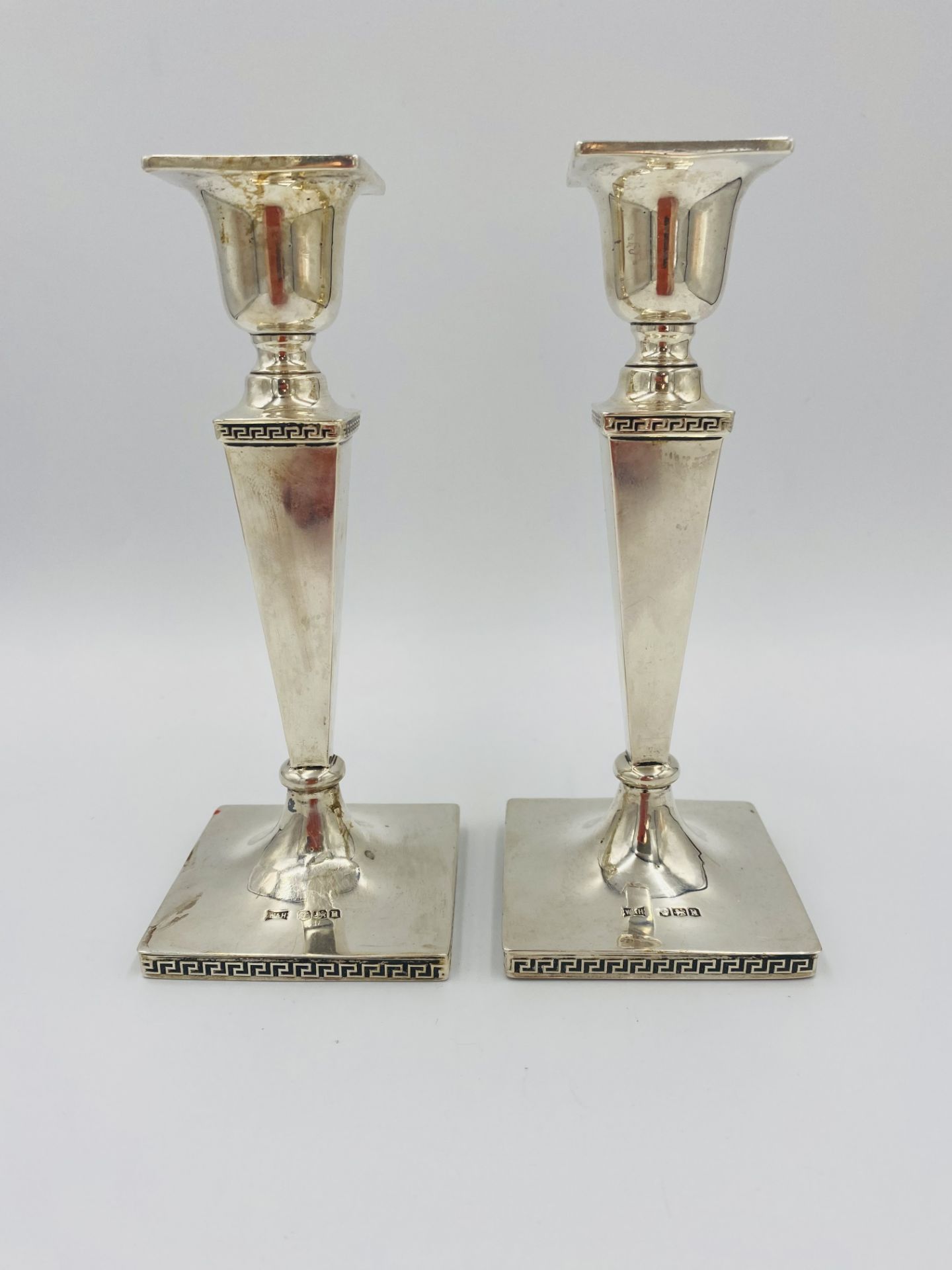 Pair of weighted silver candlesticks by Walker & Hall