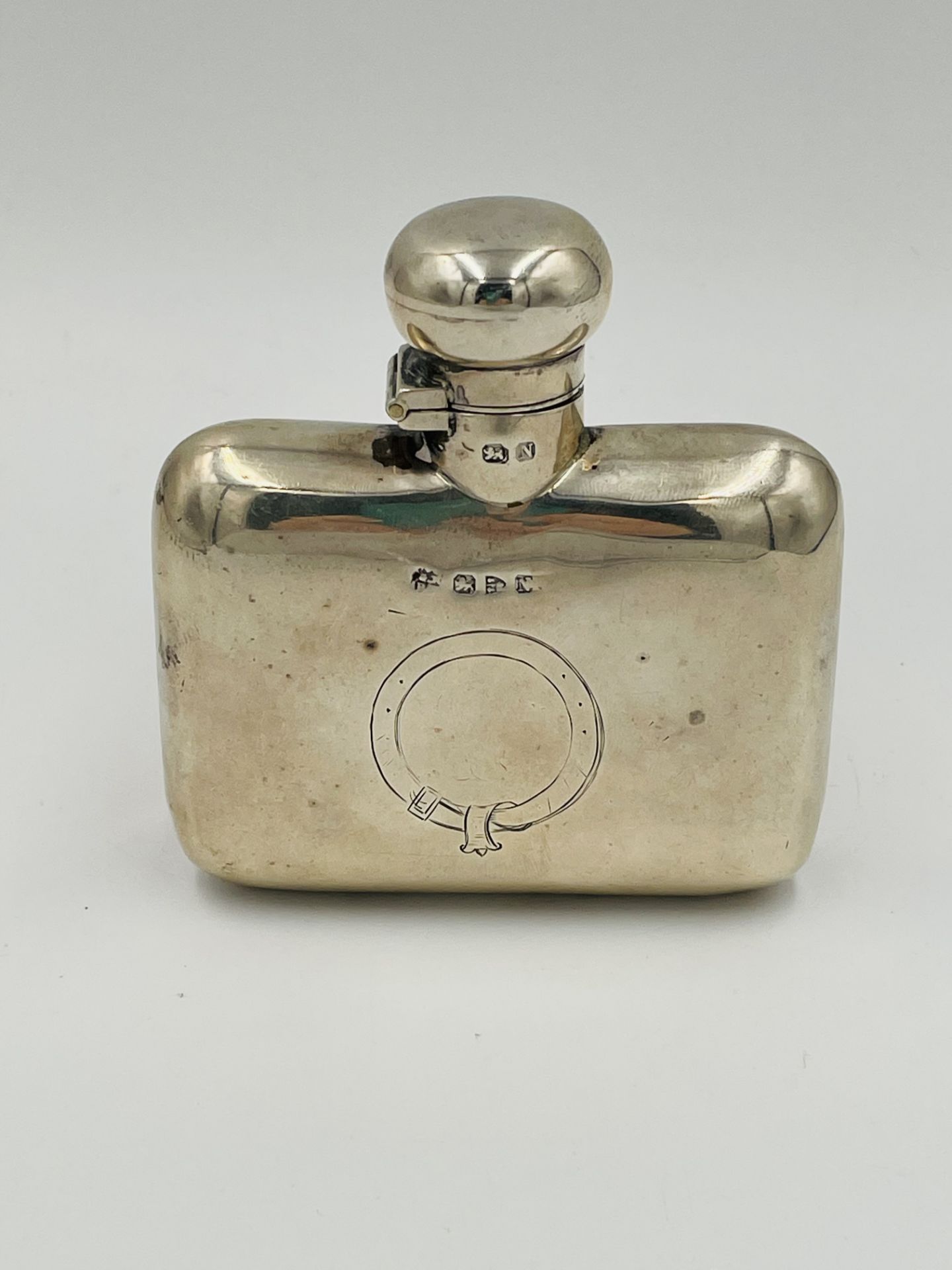 Silver hip flask.