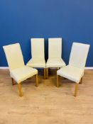 Four contemporary faux leather dining chairs