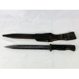 World War II bayonet written to blade Coppell G.m.b.H N20995K in leather scabbard.