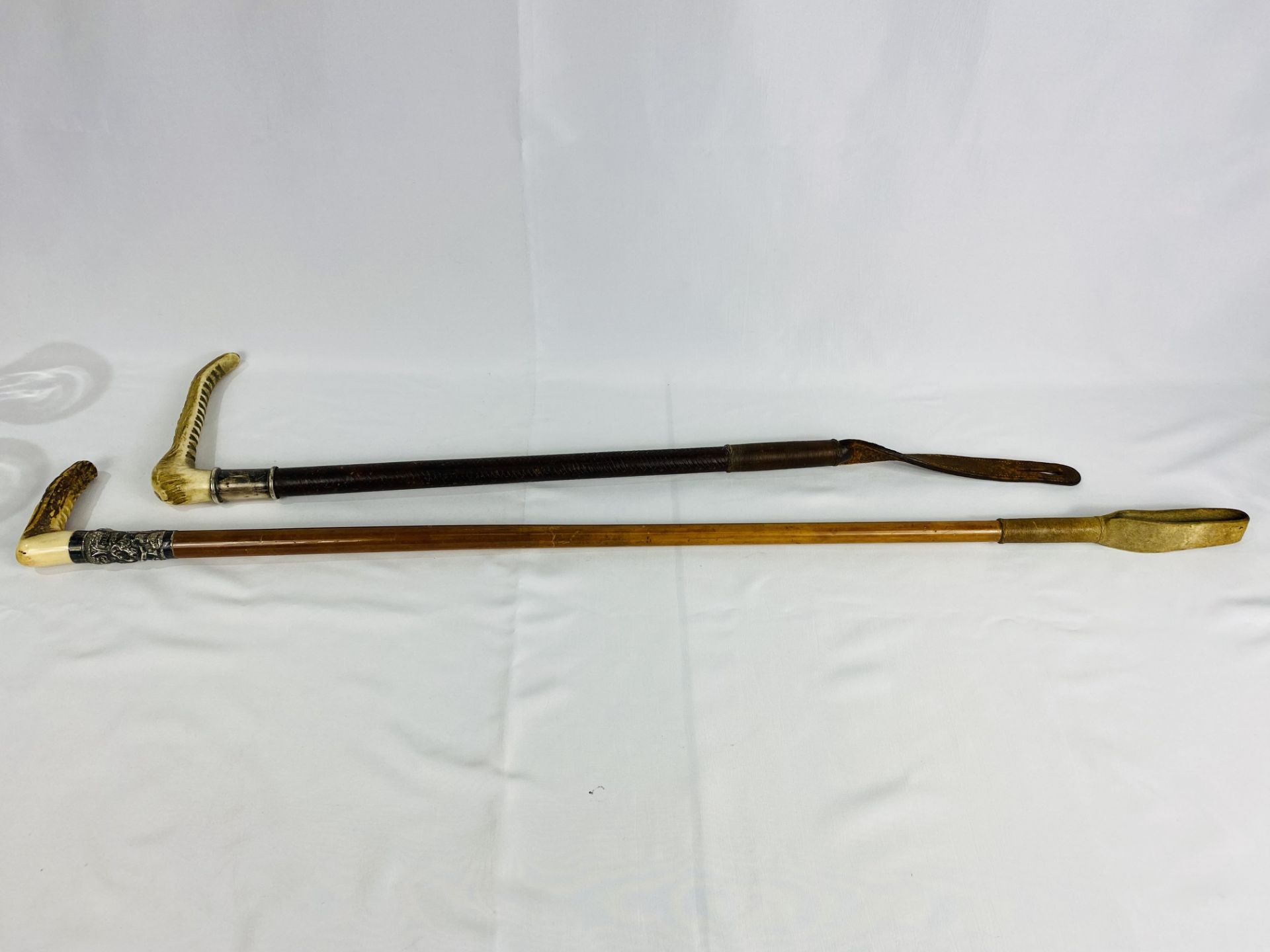 Malaquer riding crop with silver collar; together with a riding crop with silver collar.