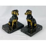 Two bronzed metal dogs