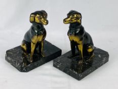 Two bronzed metal dogs