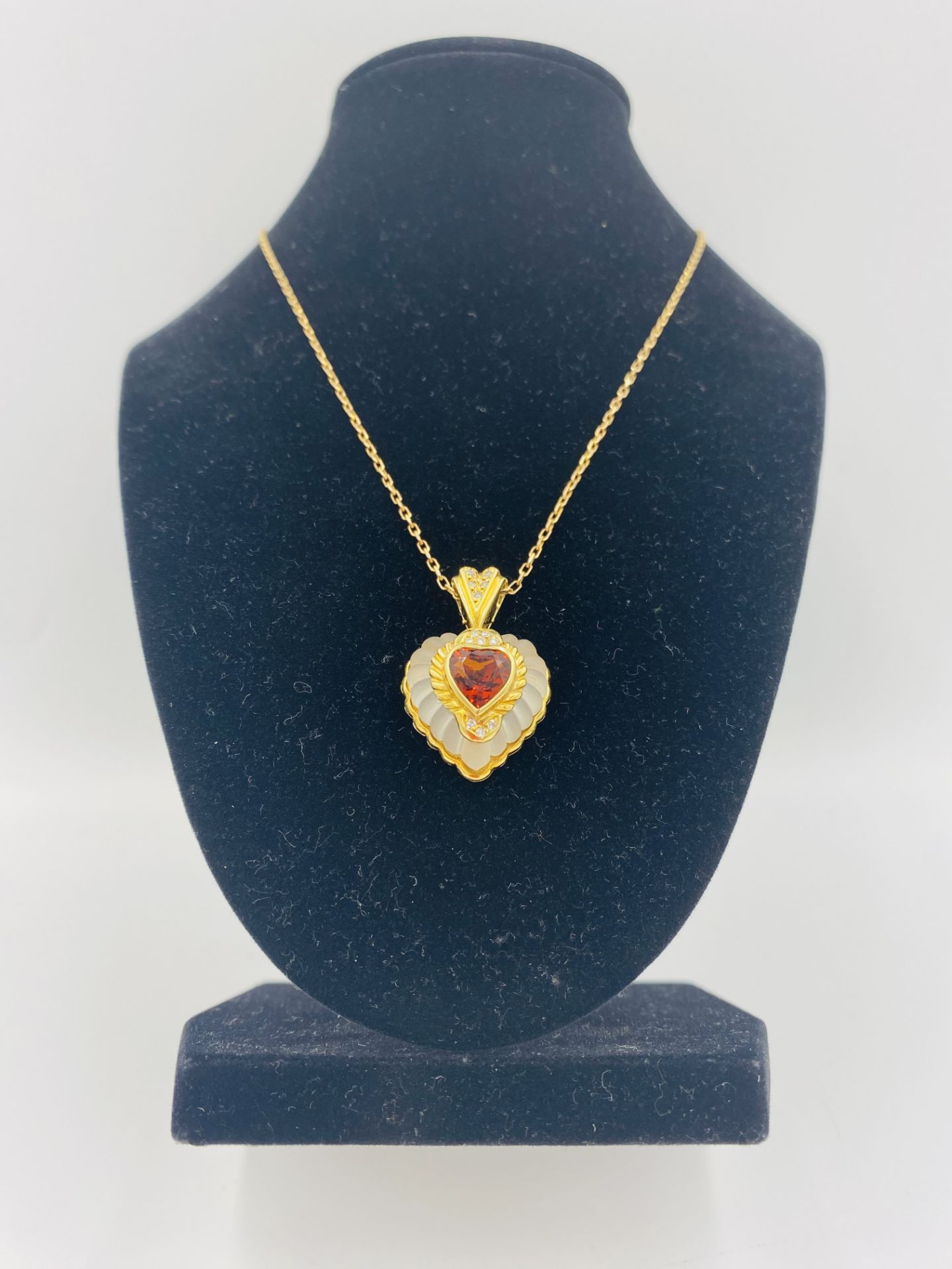 Rock crystal heart shaped pendant with 18ct gold mount