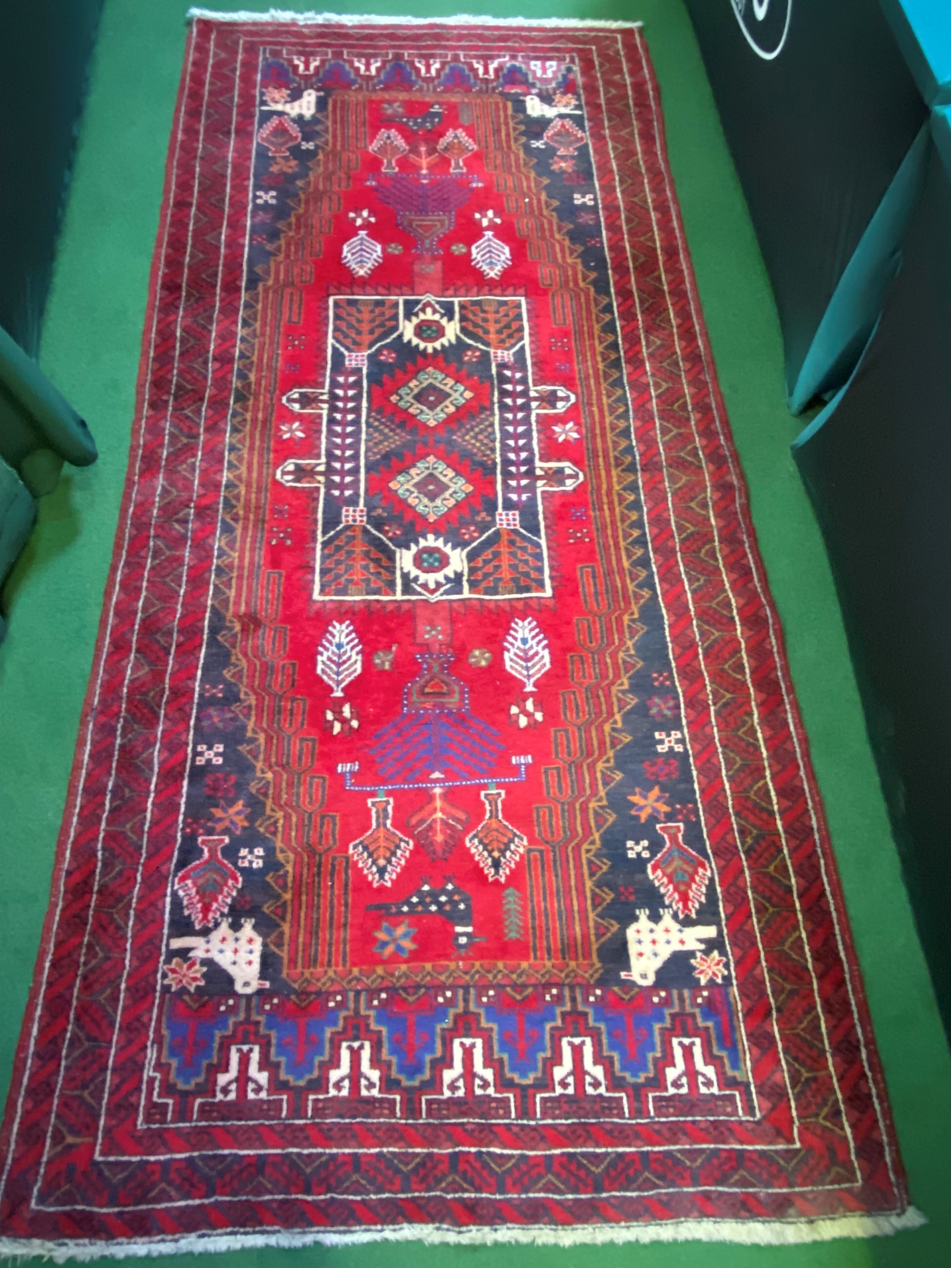 Red ground wool rug