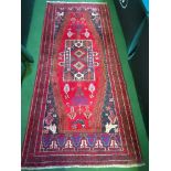 Red ground wool rug