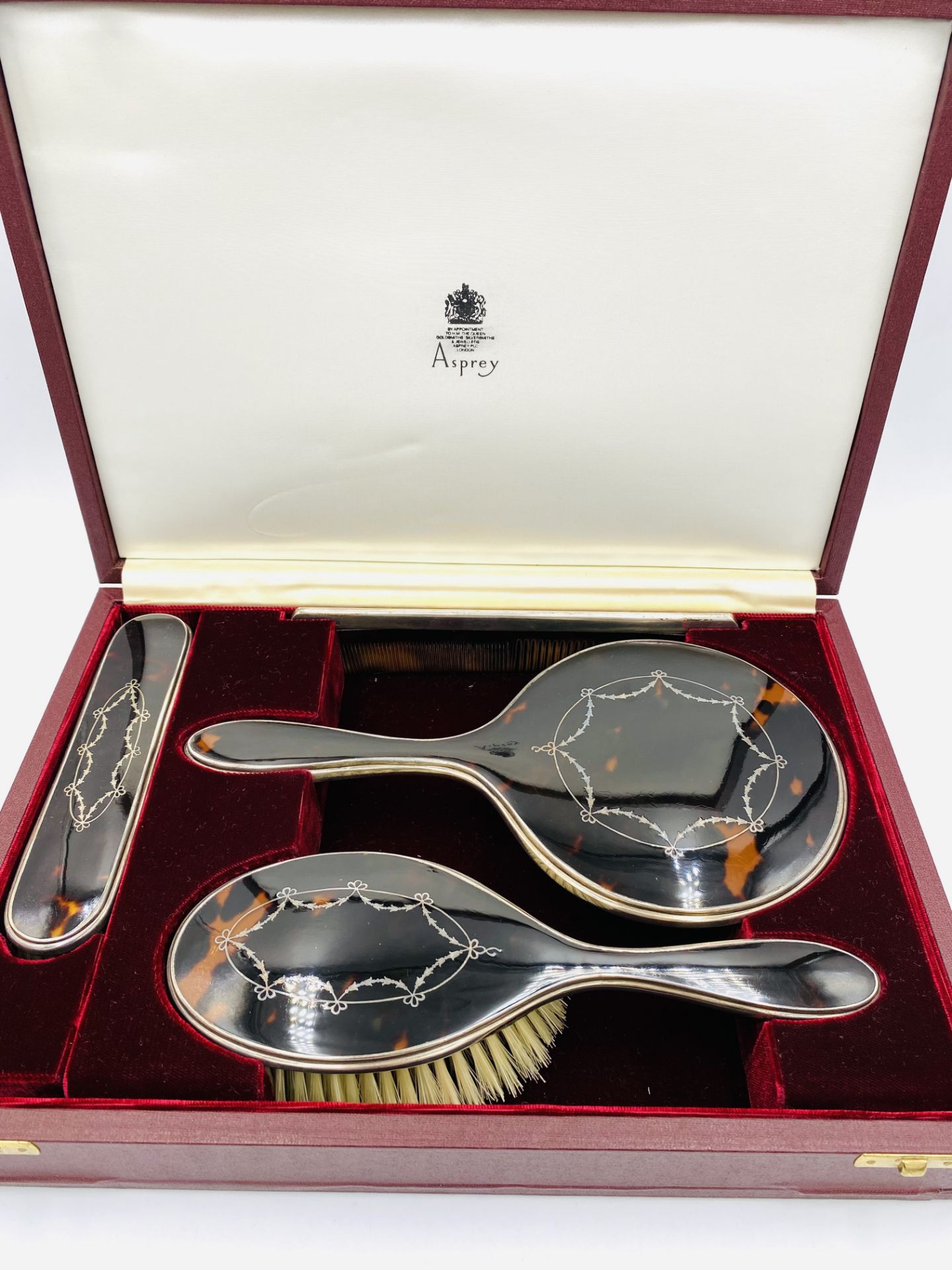 Four piece silver and tortoiseshell dressing table set retailed by Asprey