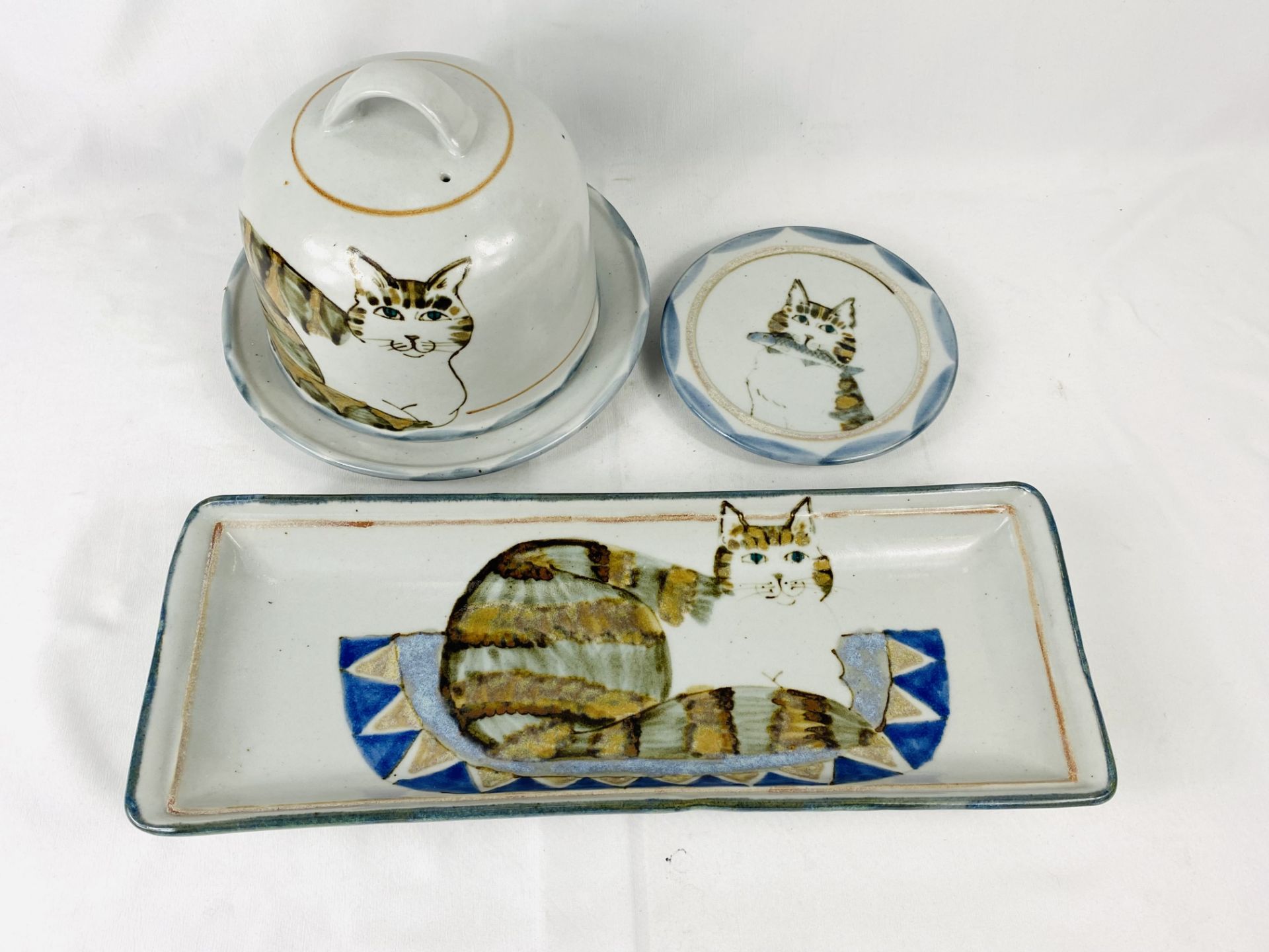 A Highland Stone cheese cloche together with two other items