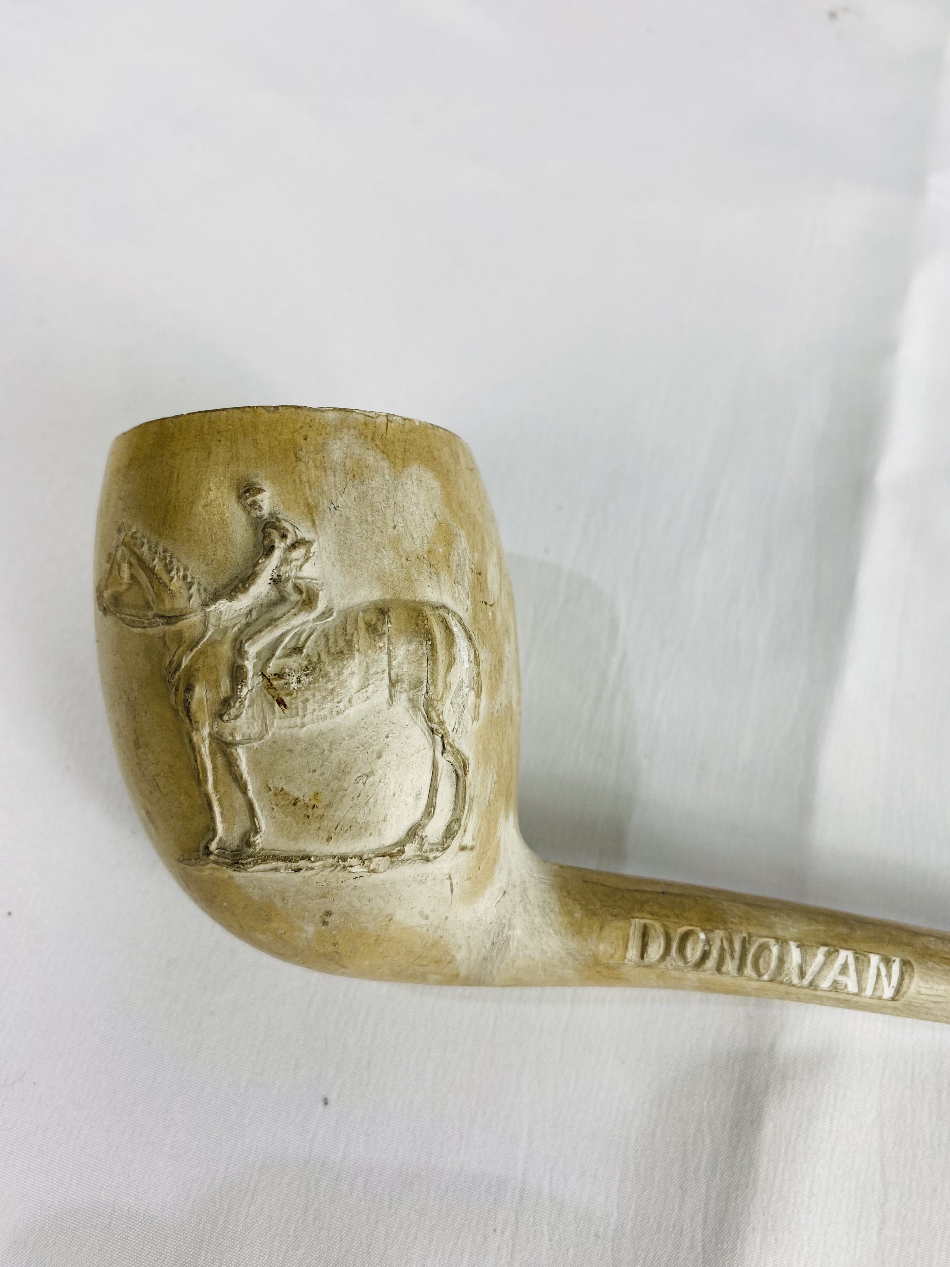 A clay pipe decorated with a jockey and racehorse, written to side Donovan and F Archer - Image 4 of 4