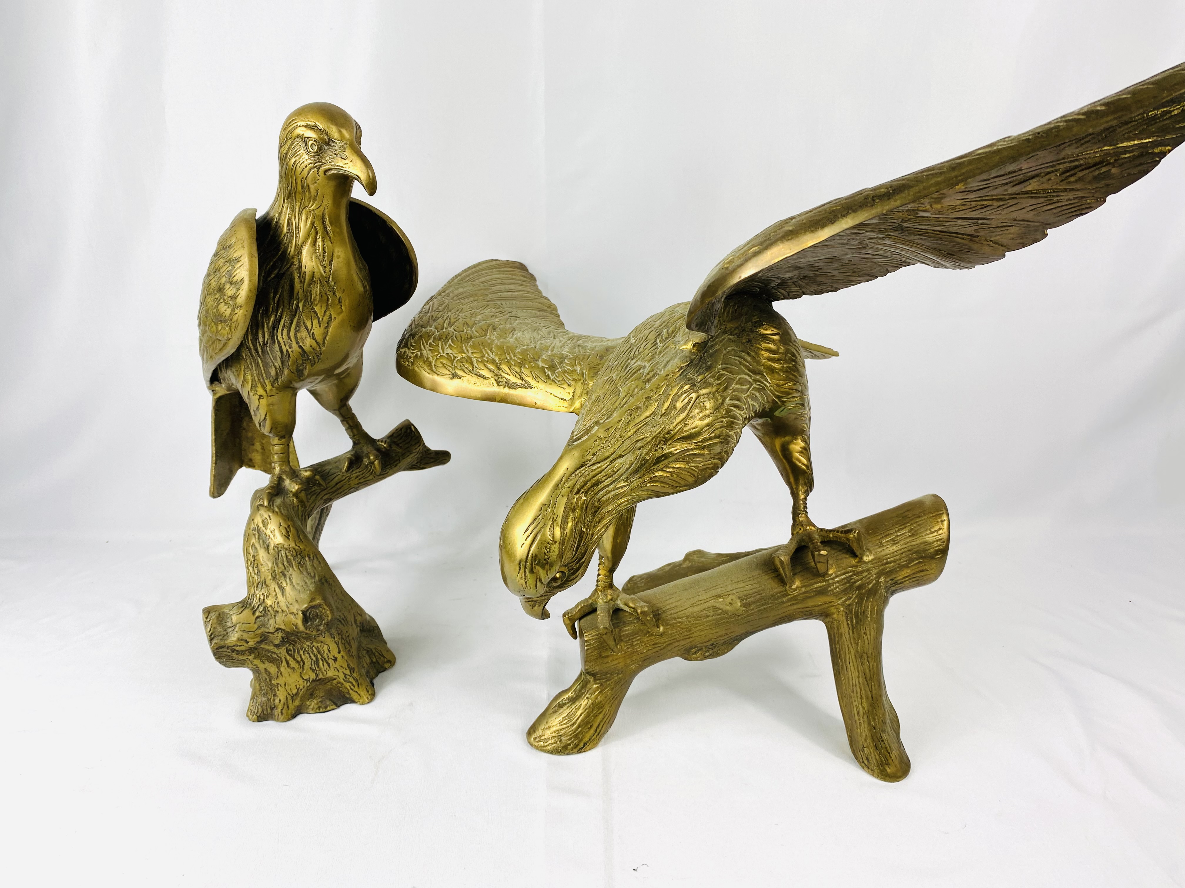 Two brass eagles, largest 68 x 48cms. Estimate £20-40.
