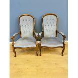 Pair of button back elbow chairs