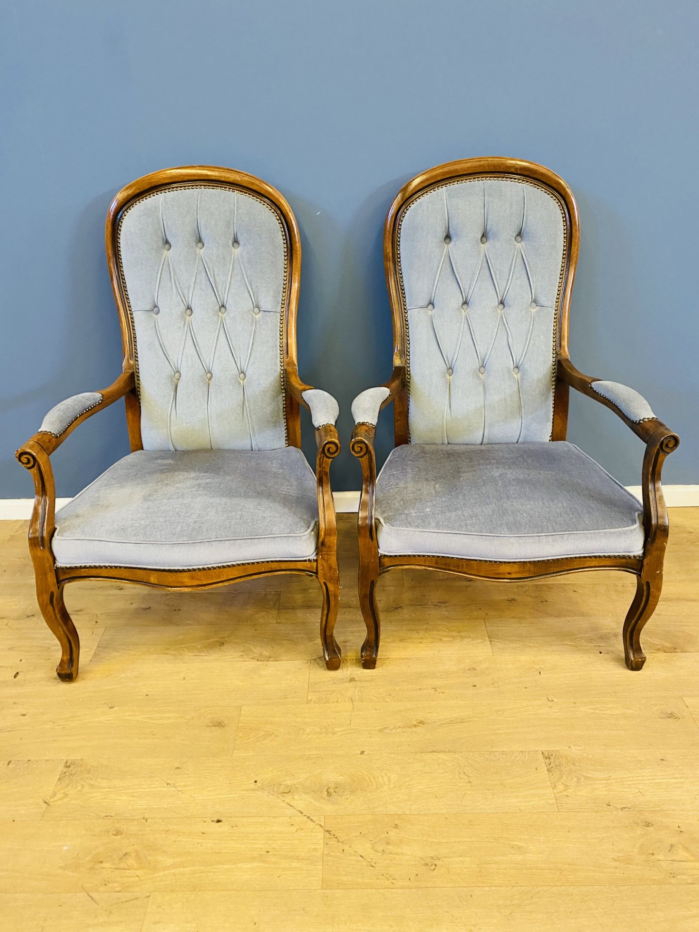 Pair of button back elbow chairs