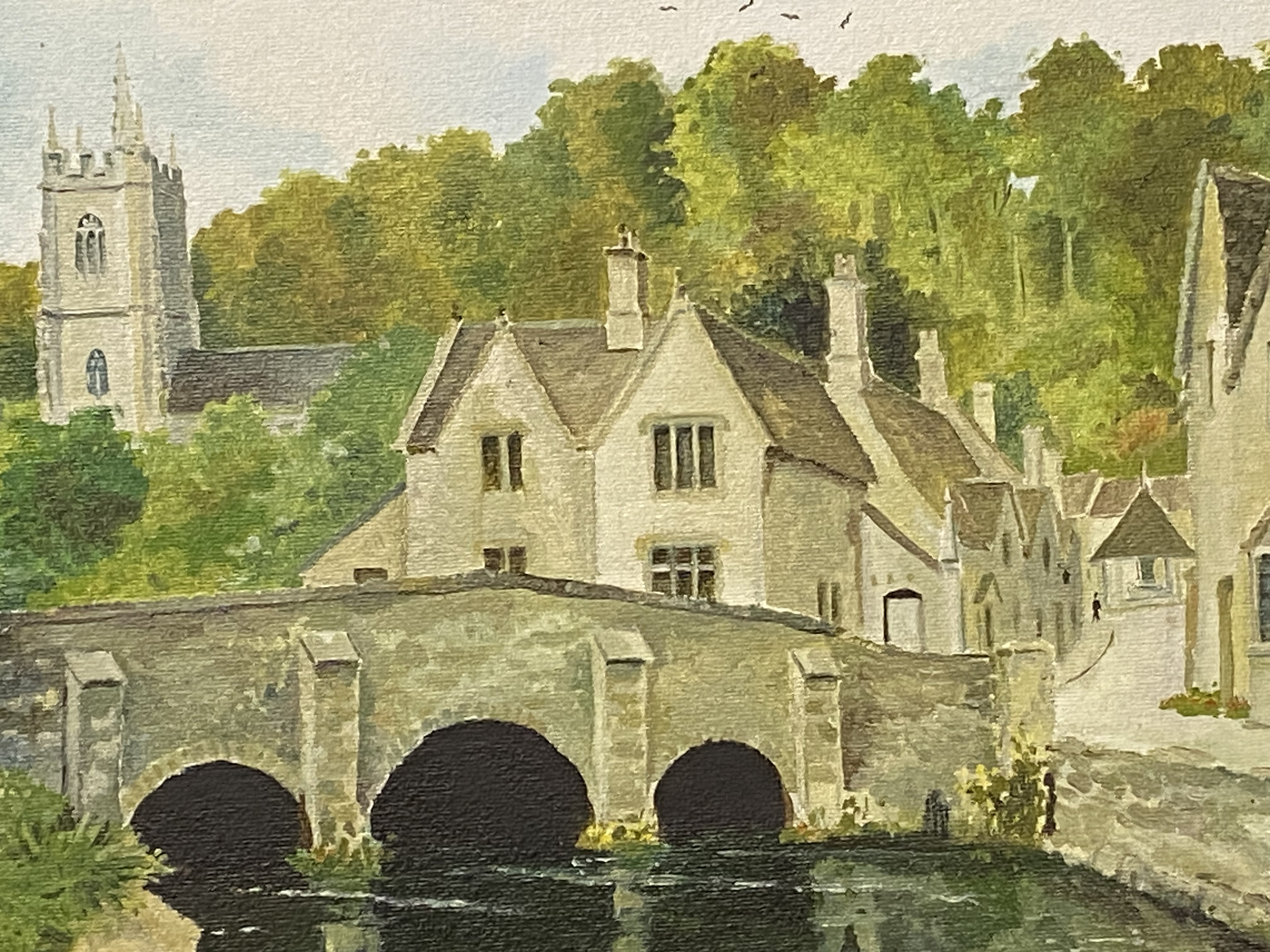 Framed oil on canvas of a village and river scene