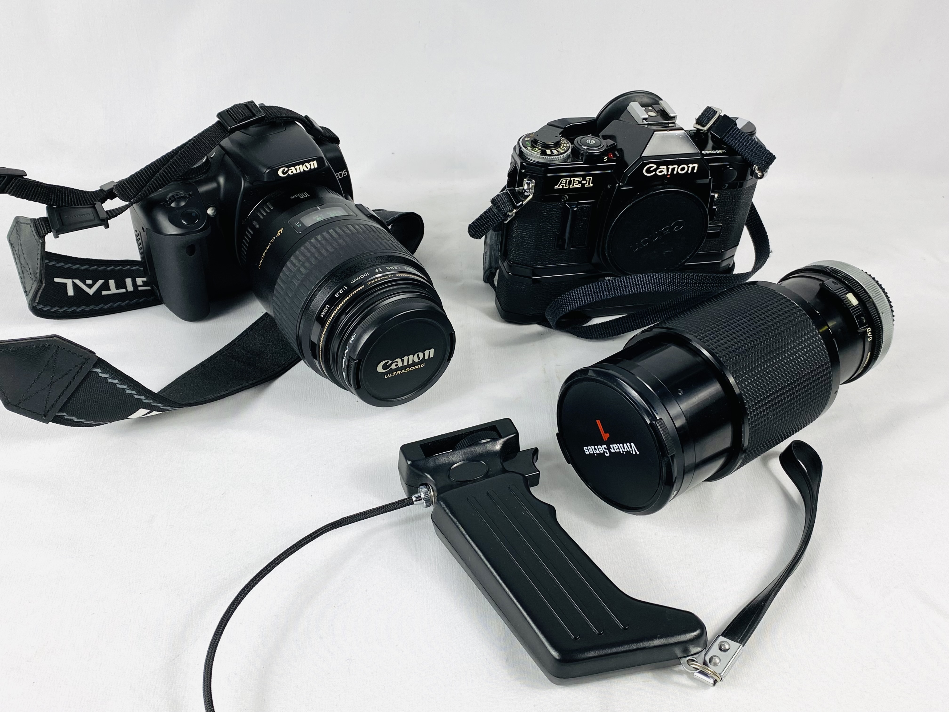 Canon EOS 400D camera and a Canon AE-1 camera