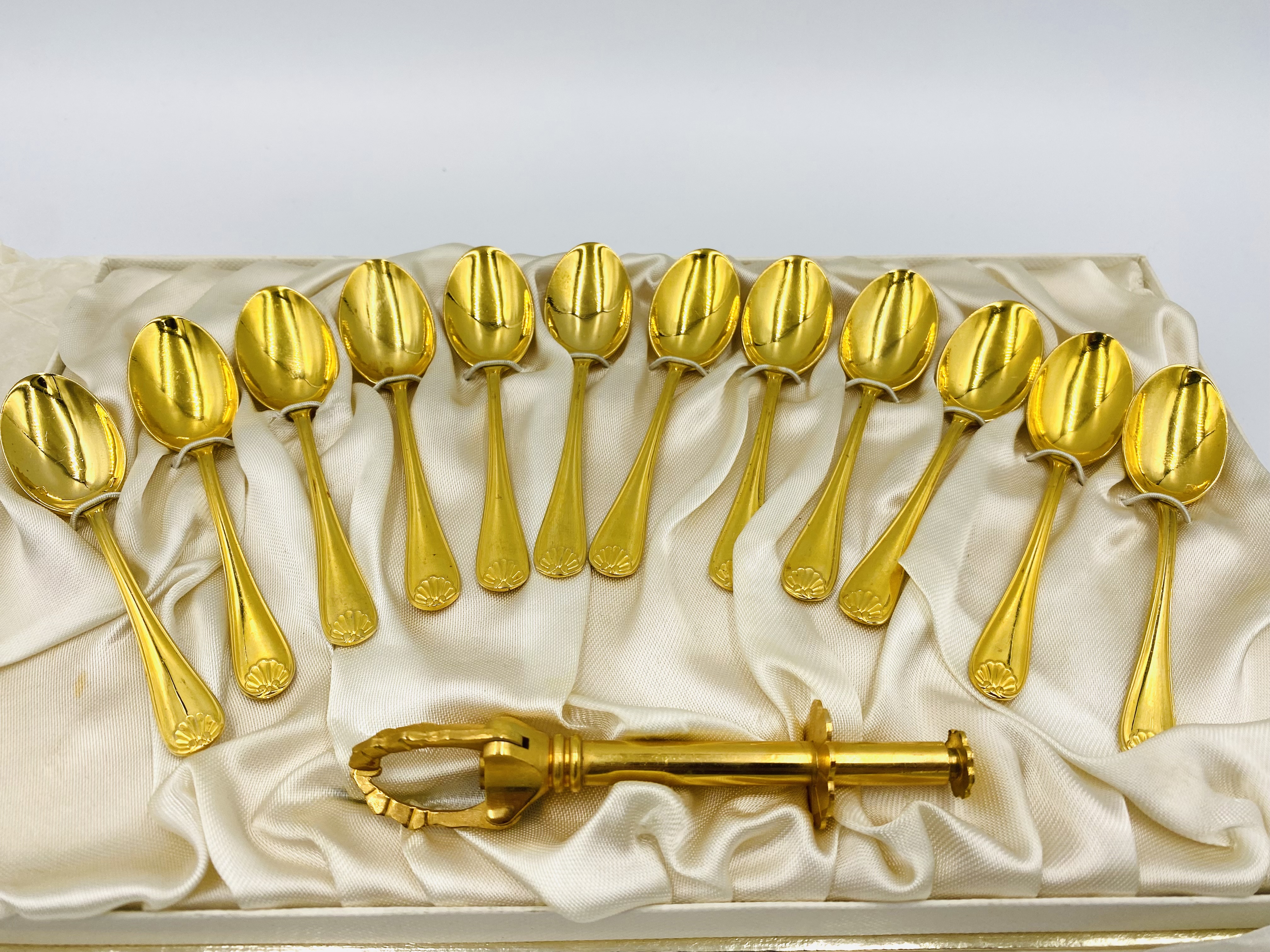 A set of gold plated coffee spoons and other items