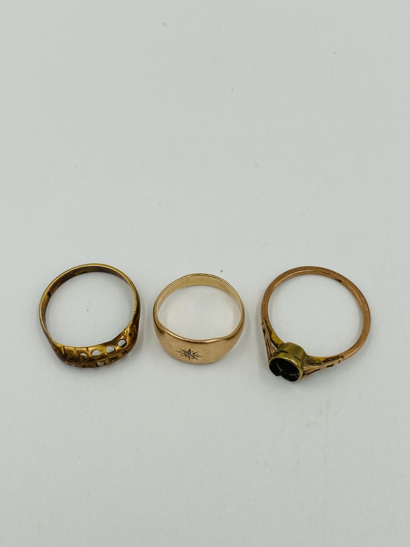 Two gold rings together with a yellow metal ring - Image 2 of 3