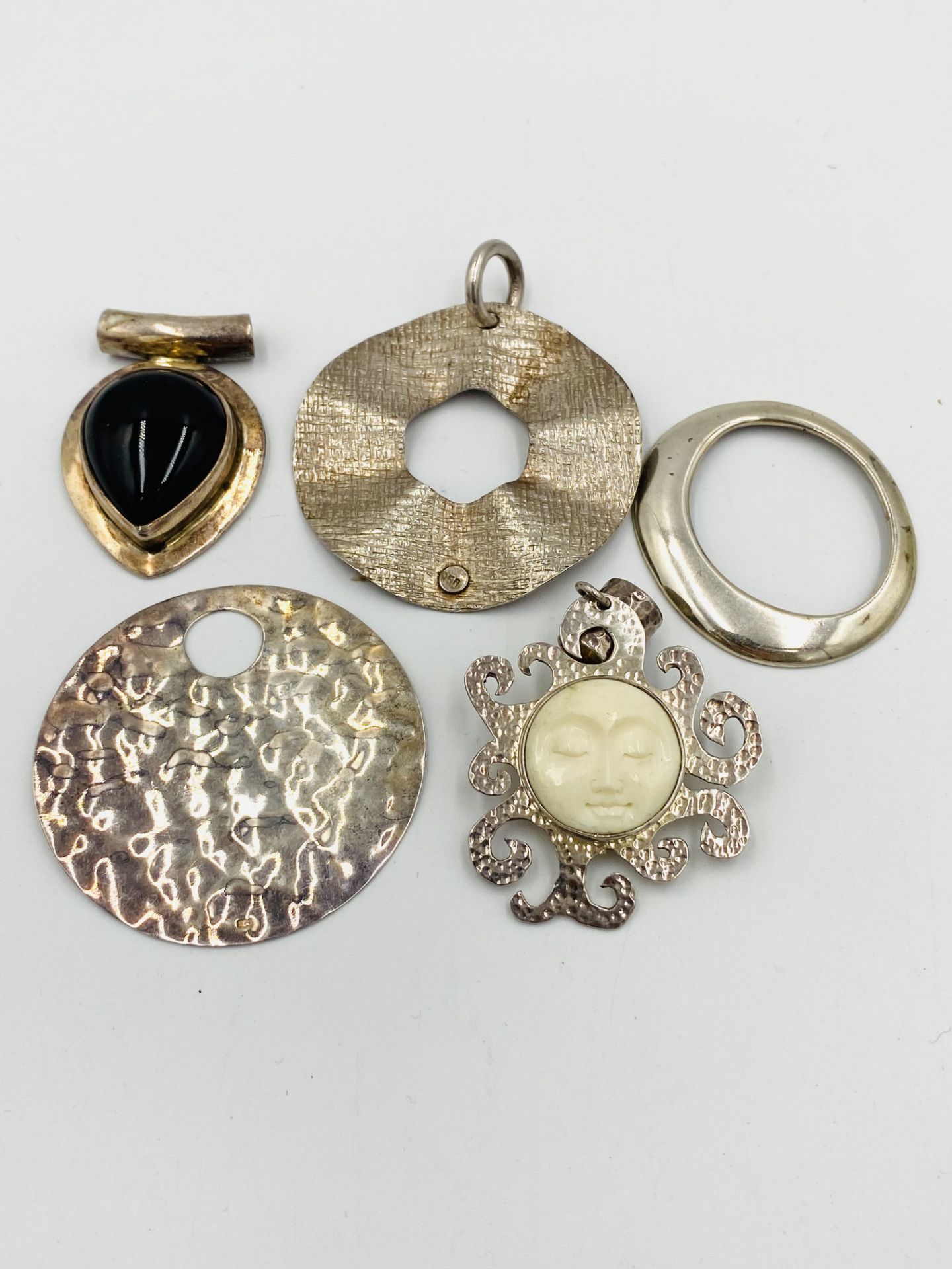 Five sterling silver pendants