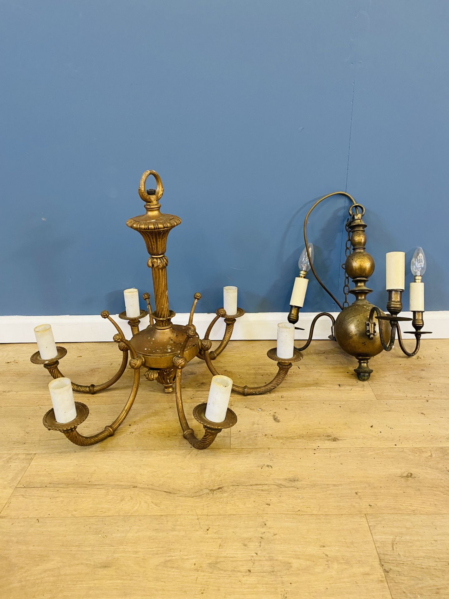 Two brass chandeliers