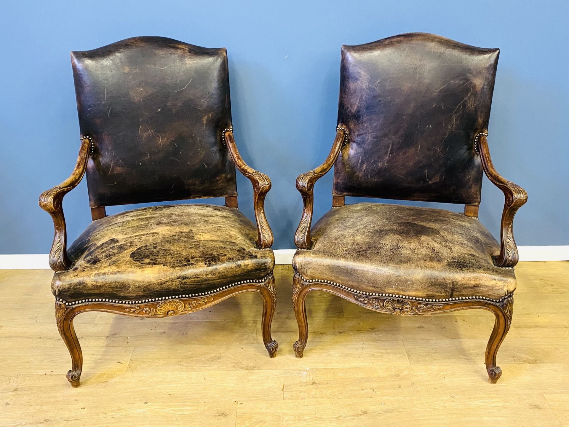 Two bow fronted mahogany open armchairs